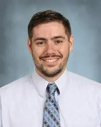 A man in a white shirt and tie.