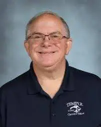 A man in glasses and a black shirt